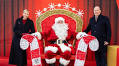 Prince Albert II and Princess Charlene help Santa do his rounds in Monaco