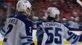 Flames' Honzek exits vs. Jets with upper-body injury