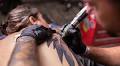 Gen Z worker who asked for a paid day off to get tattoo... for her mental health - as TV star boss said they felt obliged to cave in