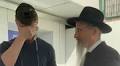 Ex-hostage Sasha Troufanov wraps tefillin with Russian chief rabbi day after release