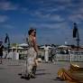 Photos show glamour at the Dubai World Cup horse race but thinner crowds due to Iran war