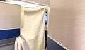 United Business Class Passenger Uses Hair Clips And Blanket To Build DIY Suite Doors For Privacy