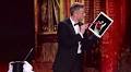 iPad magician wears Apple tablet like a glove for tribute to Cardini.