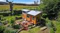 Man crafts stunning 'hodgepodge' tiny home using only reclaimed materials: 'Built for the cost of two years' rent'