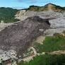 Mound of garbage collapses at Philippine landfill, burying and trapping 38 people and killing 1