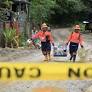 Landslide in Philippines mining town kills nearly 100, prompts calls for action