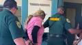 WATCH: Brevard Sheriff Walks Two Suspects Into Ivey's Iron Bar Lodge on Animal Cruelty Charges