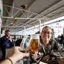 Wetherspoon boss hits back at Ryanair's 'Big Brother' approach after airline's plan to scrap airport breakfast pint