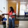 Licensable picture: Principal Ebony Johnson talks to a student during the last day of school at Manchester Elementary School in Spring Lake on
