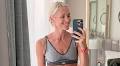 Jenni Falconer, 49, flaunts her washboard abs in a grey sports bra after admitting she hasn't eaten crisps or chips for 34 years