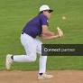 Licensable picture: Watertown Arrows 14U first baseman Dray Dahlgren attempts to make a running catch in foul territory during a game in the