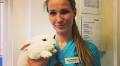 Sexy veterinarian snaps photos with cute animals