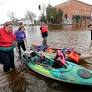 New London volunteers brave flood water in search of stranded animals