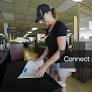 Kathy Rigsbee Allen, 54, of West Borough, Mass., places price tags on furniture for sale at Romeo and Juliet Furniture, a