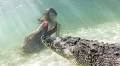 Models swim with crocodiles for photoshoot underwater in Mexico