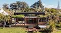 Two Lofts Connected by a “Bridge” Fit Inside These Tiny Homes