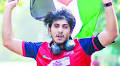 Tawsif Mahbub in marathon holding Palestinian flag
