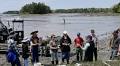 High schoolers learn about shellfish firsthand on field trip to clam flats