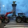 Fuming French farmers camp out in Paris despite government pledges