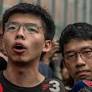 Hong Kong: Joshua Wong jailed over banned Tiananmen vigil