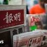 Hong Kong journalists protest at editor's sacking with blank columns