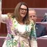 Wrapped in plastic: Sarah Hanson-Young waves a dead salmon in Senate – video