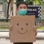 Singapore: Jolovan Wham charged for holding up a smiley face sign