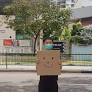 Singapore activist faces fine over one-man smiley face sign protest