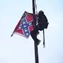 Woman takes down Confederate flag in front of South Carolina statehouse