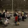As Airstrikes Loom, Hundreds of Afghan Refugees Still Stranded at U.S. Base in Qatar
