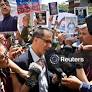 People and family members of detainees gather outside Venezuela's National Assembly