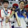 China’s He praised for holding Spanish flag on podium in injured opponent’s honour