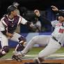 U.S. baseball falls to undefeated Japan in 10 innings, complicating medal quest
