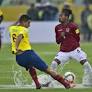 Sport picture of the day: Ecuador and Bolivia play in the puddles