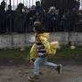 Refugee children in Greece face protest on first day of school