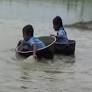 WATCH | Kids in Assam cross river in aluminium pots to reach school